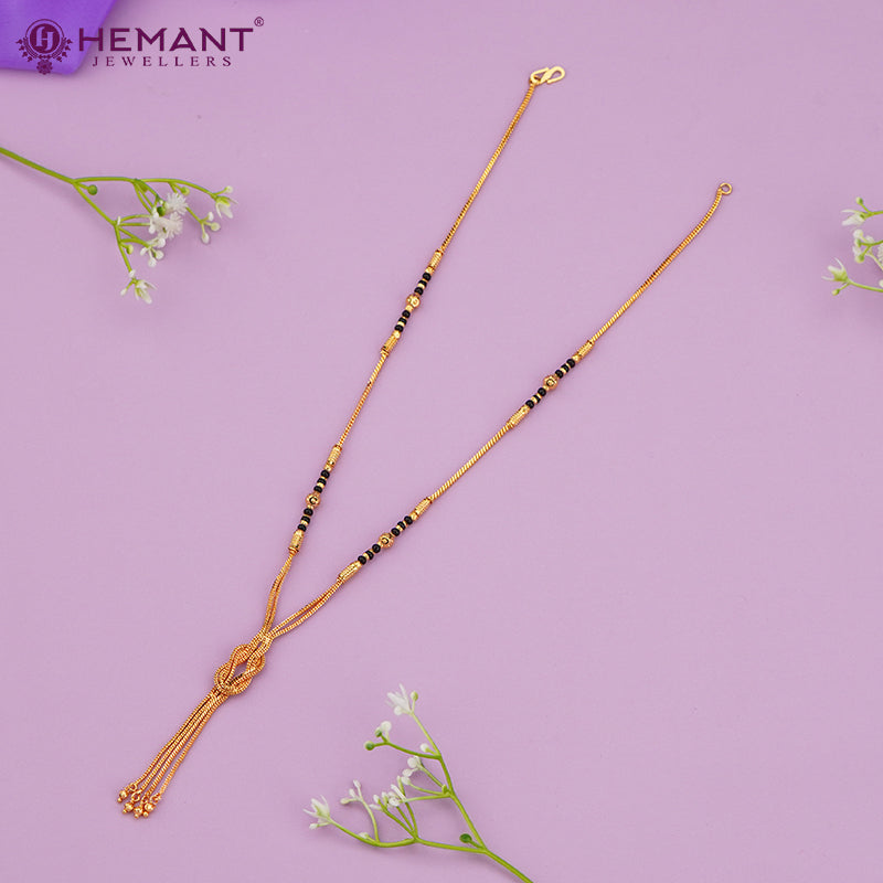 Elegant Gold-Plated Dual Chain Mangalsutra with Black Beads & Central Knot Tassel – 4294
